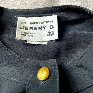 Bomber jacket. Brown and black. Rayon and polyester blend. Fitted.